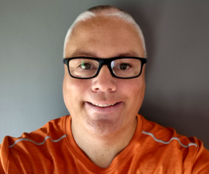 Photo of Kev in orange shirt